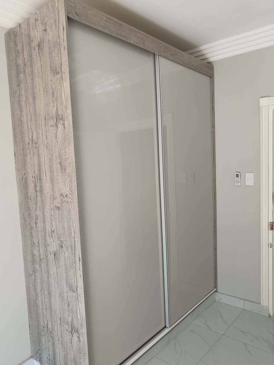 Bedroom cupboards with integrated headboard